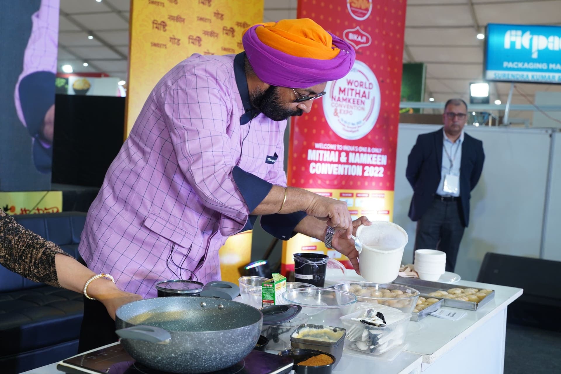 A chef prepares mithai during a live demonstration