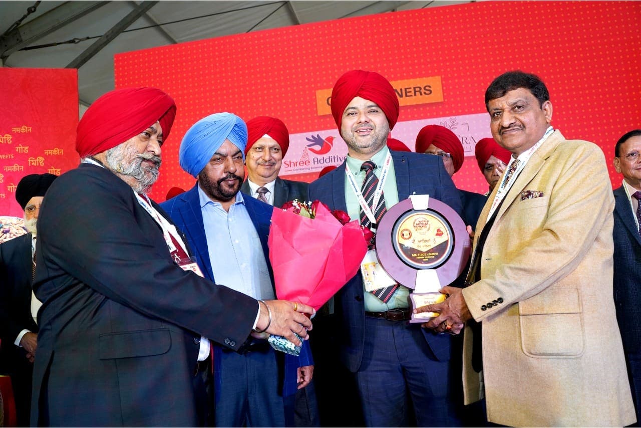 An award is presented to an industry leader on stage